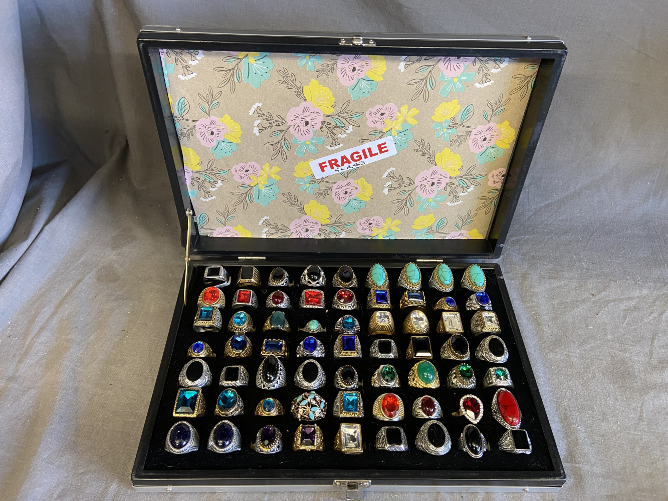 Large lot of mixed rings in case 63 in total