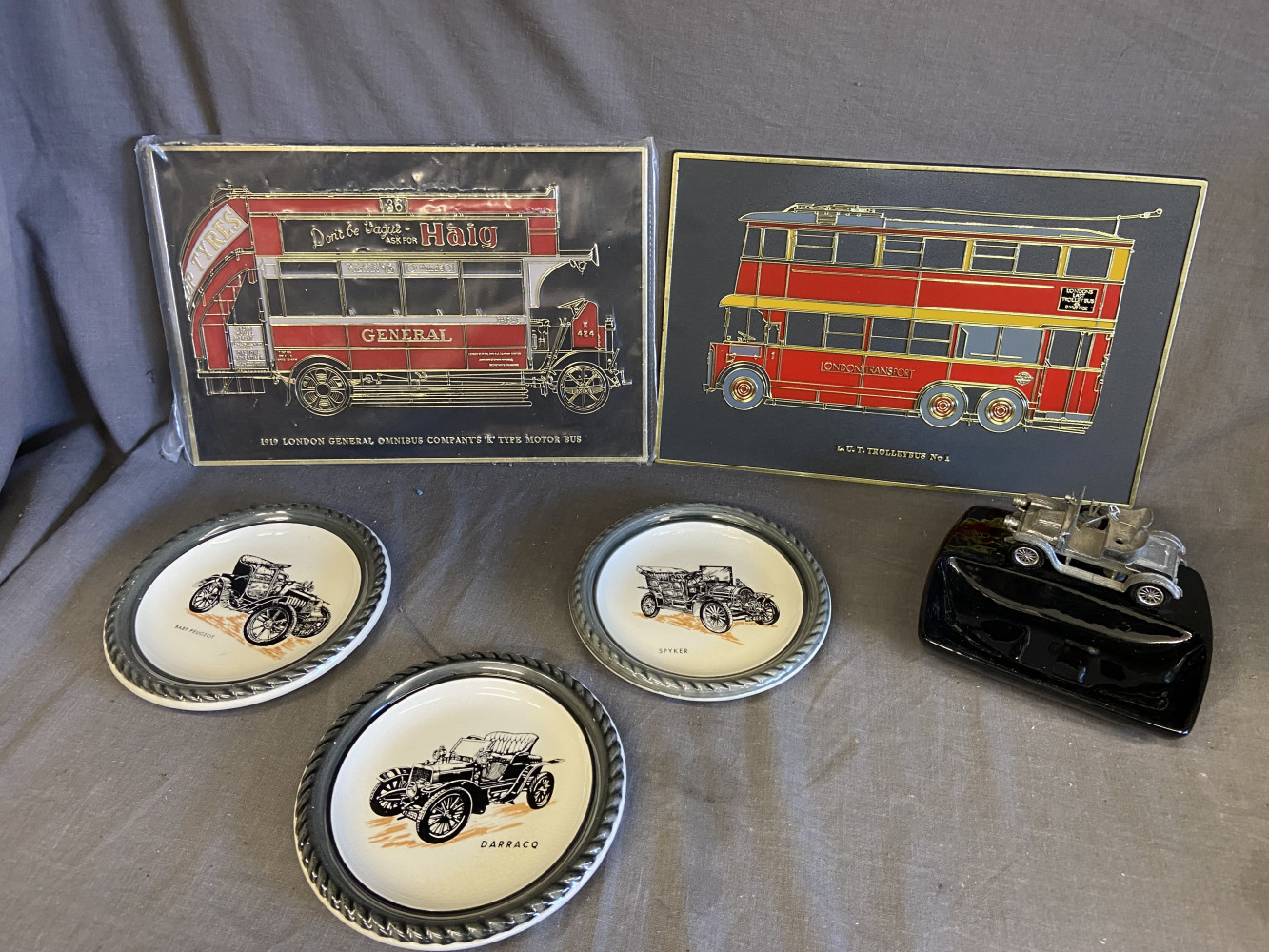 2 bus plaques, ashtray with car and 3 small car plates