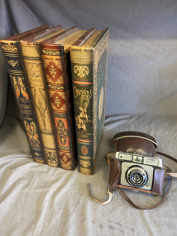 Vintage camera and box in style of books
