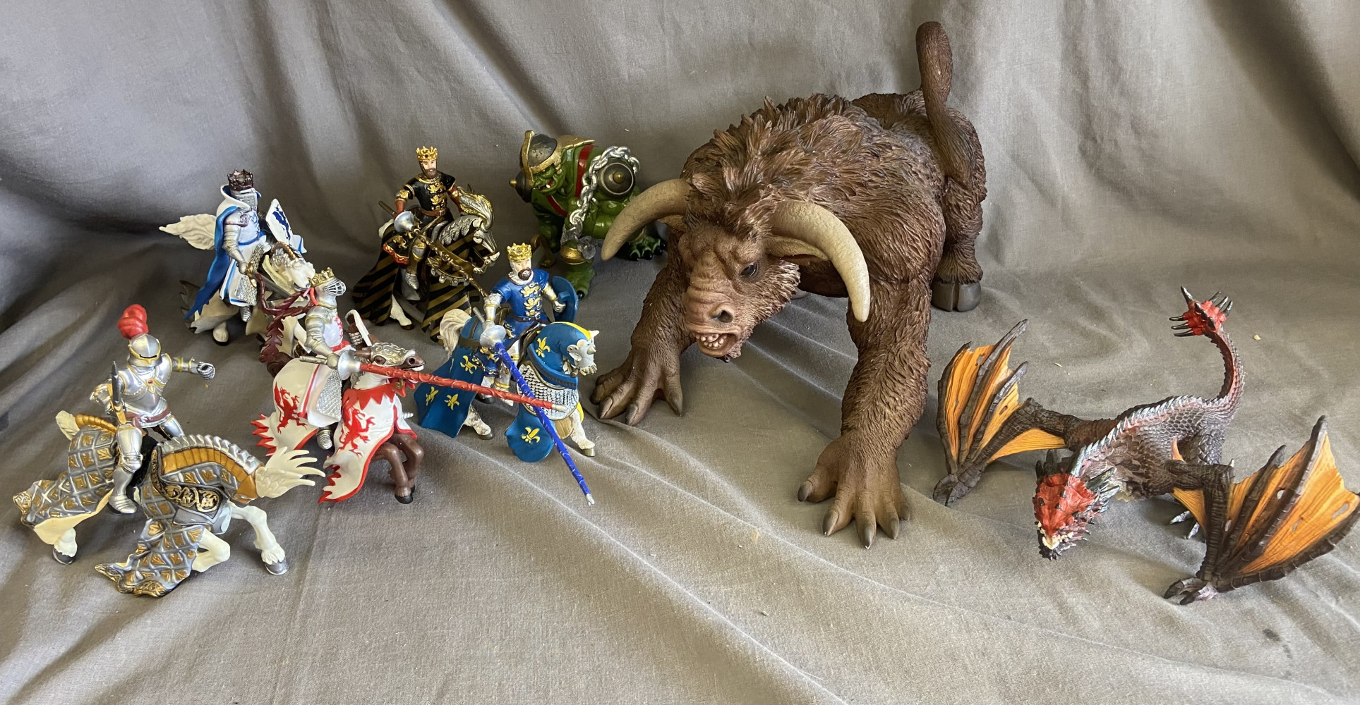 Large Minotaur, 5 knights on horse back, a dragon and a troll,