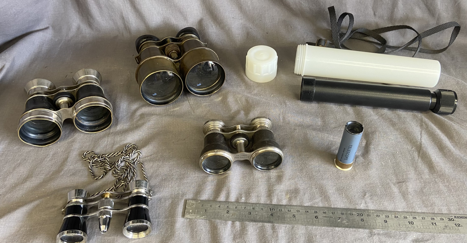 2 pairs of vintage binoculars, 2 pairs of opera glasses and two telescopes one is in the form a bullet