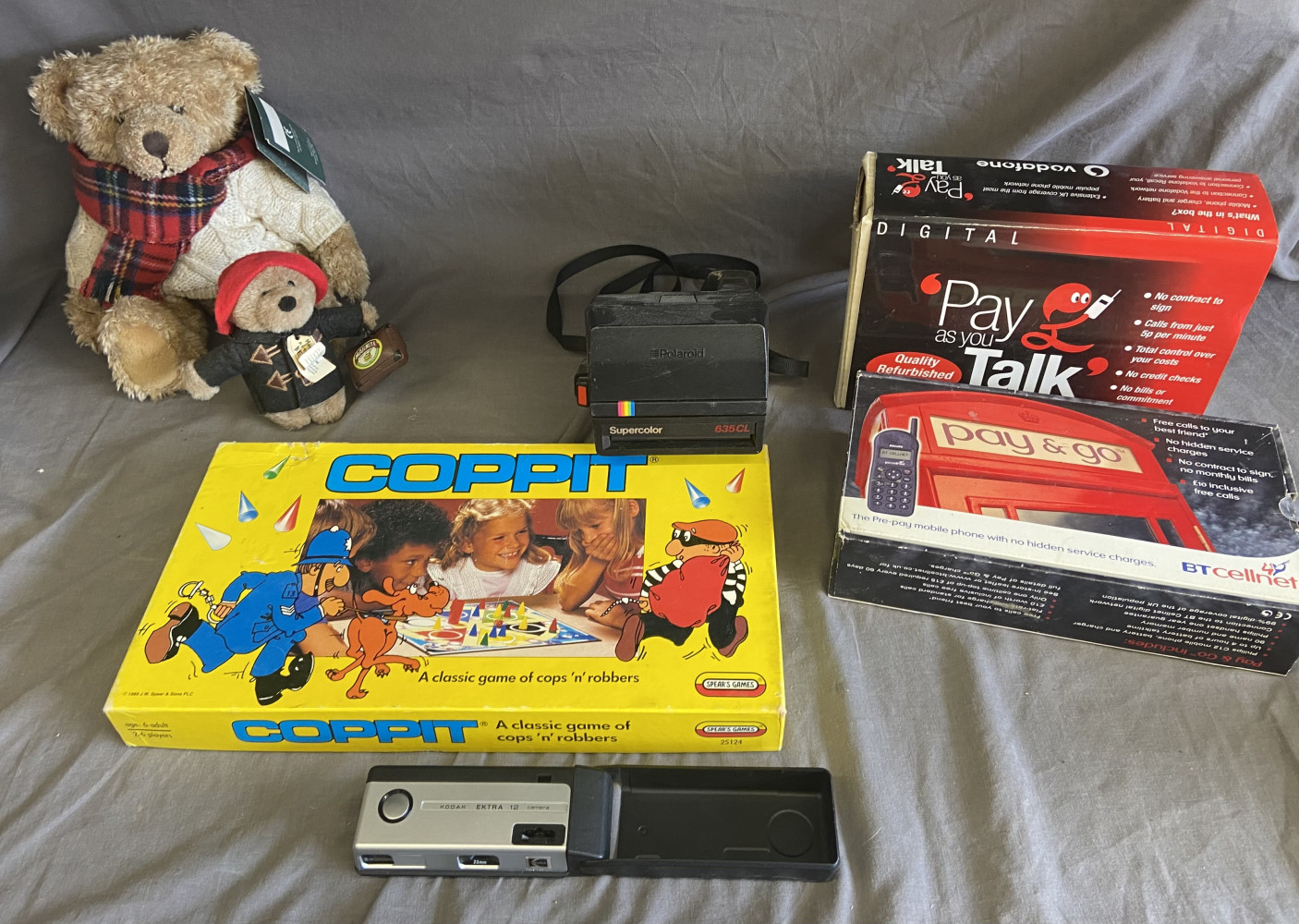 Polaroid camera, mobile phones, teddy bears and other household items