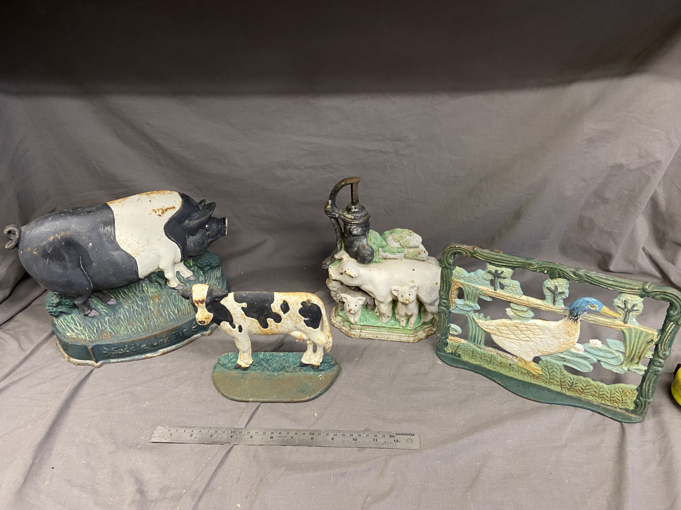 4 cast iron door stops