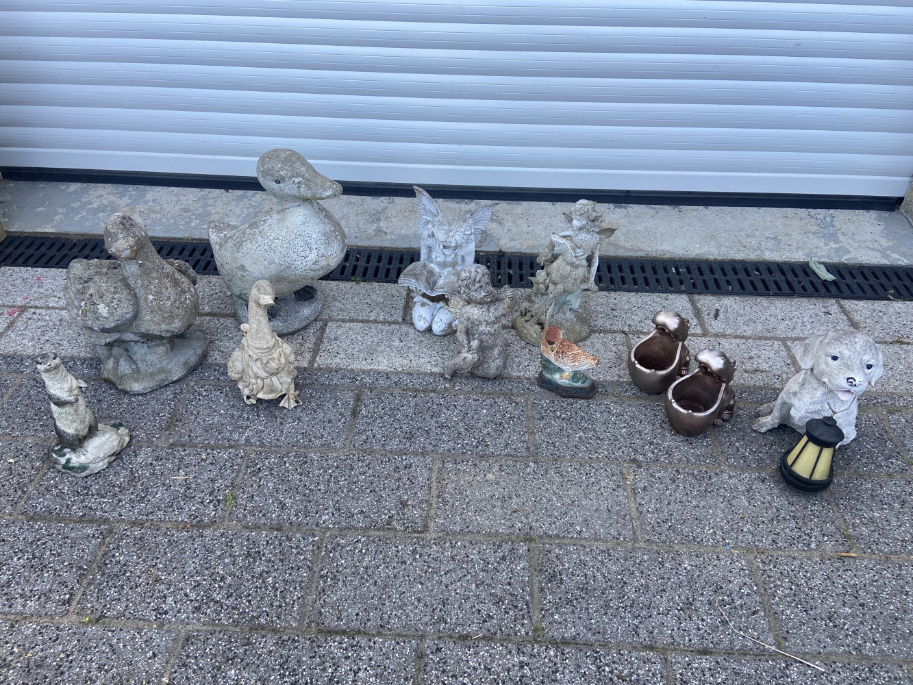 Large quantity of garden statues, inc fairies and ducks