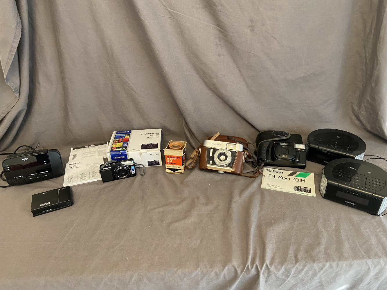 Mixed cameras and alarm clocks inc digital Olympus camera