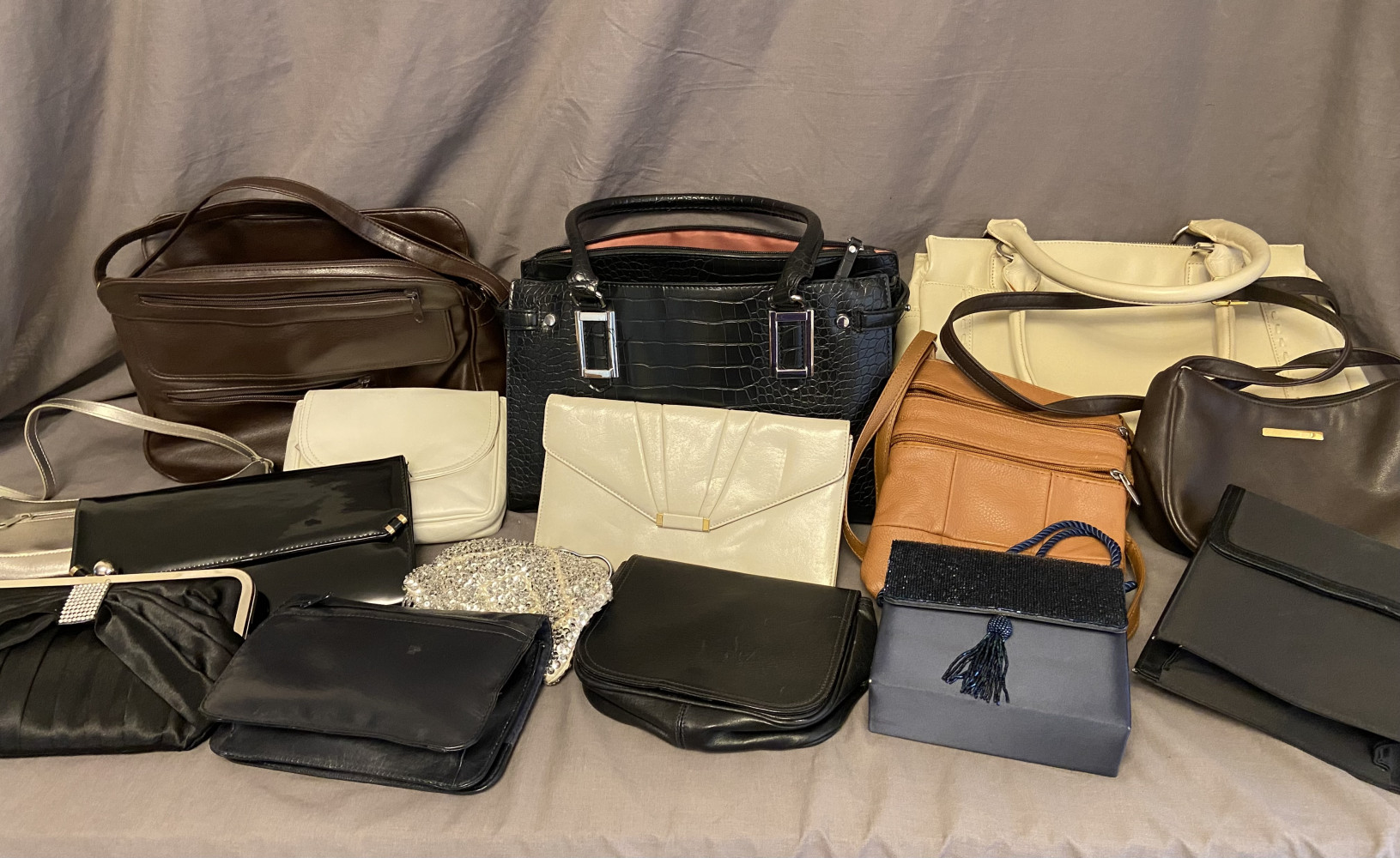 Large collection of handbags