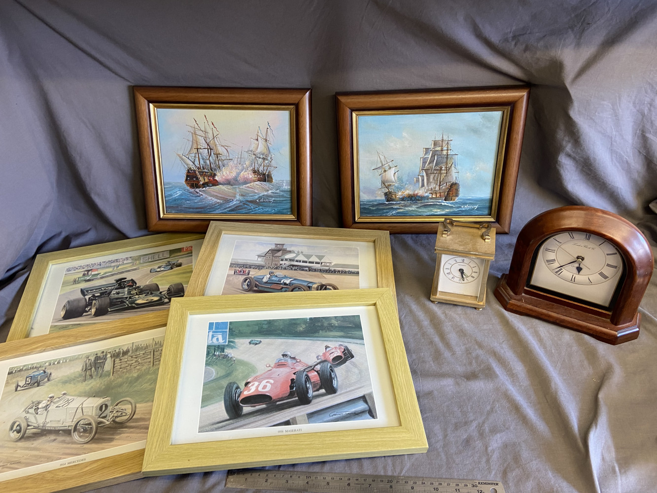 4 race car pictures, 2 small clocks and 2 signed oil on boards of boats