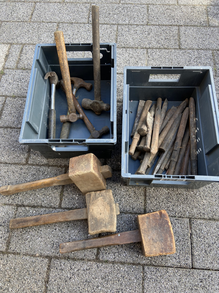 Heavy metal chisels and breaker tools and box of various hammers