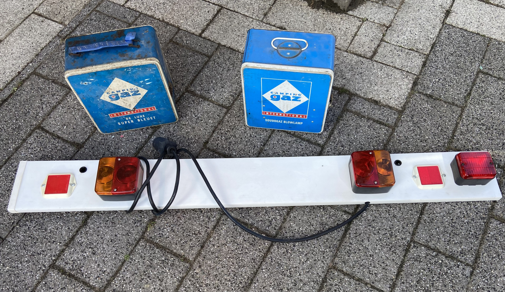 2 Gaz boxes, one with camping stove the other with blow torch and a trailer board