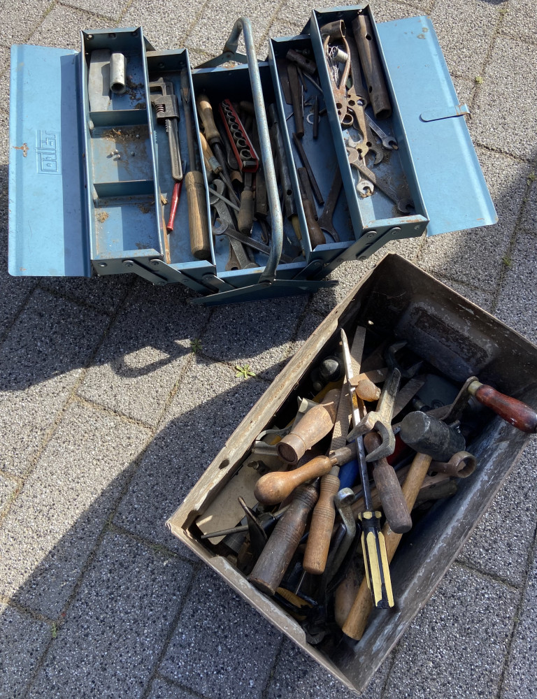 Metal tools box and metal bin loaded with tools