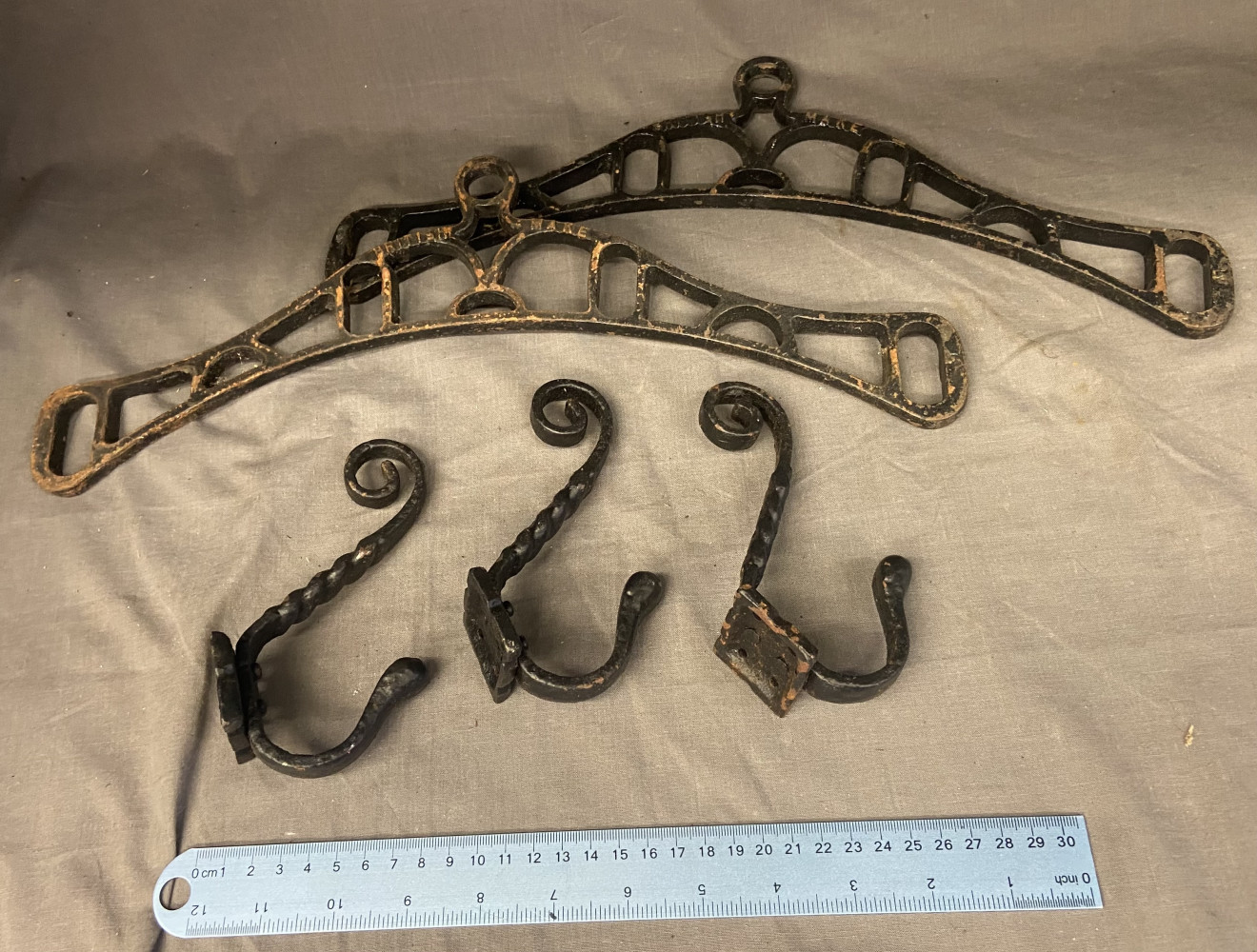 3 ornate coat hooks and a clothes airers metal work