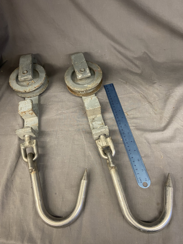 2 large heavy meat hooks on rollers
