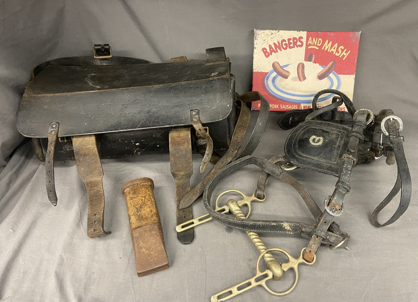 Vintage leather tool bag, horse bridle, wall sign and wedge tool