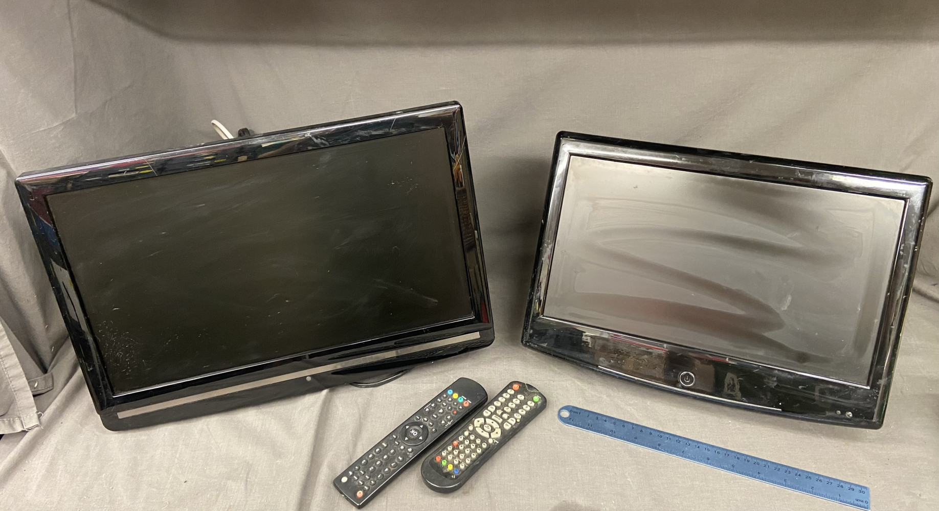 2 small televisions with wall brackets