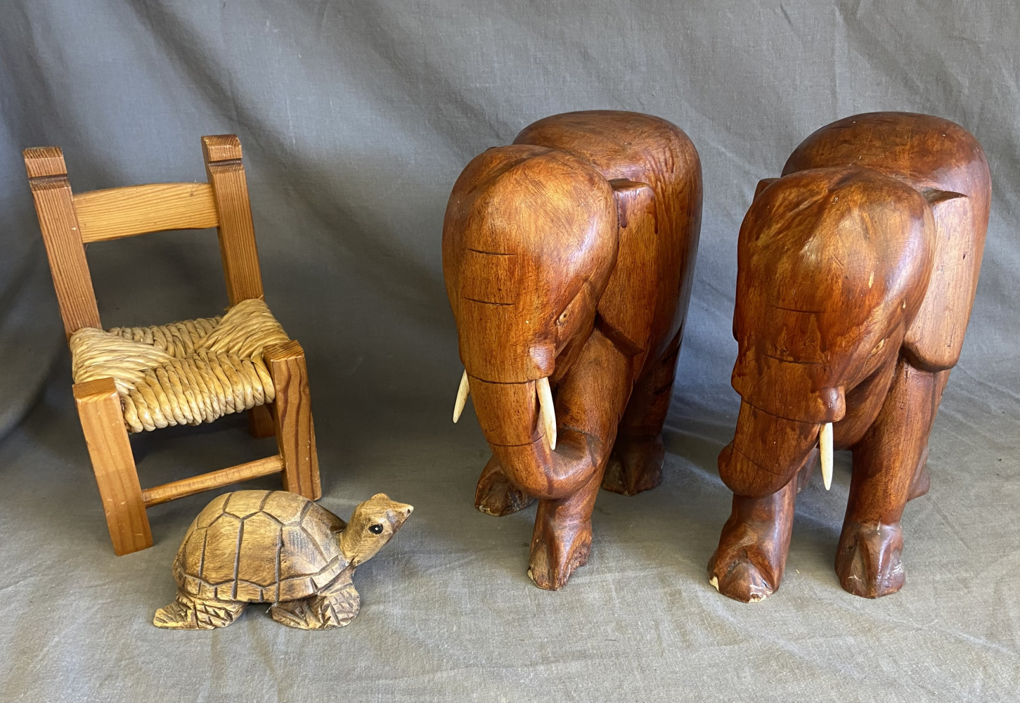 2 large elephants 23cms tall one missing a tusk, small dolls chair and wooden tortoise