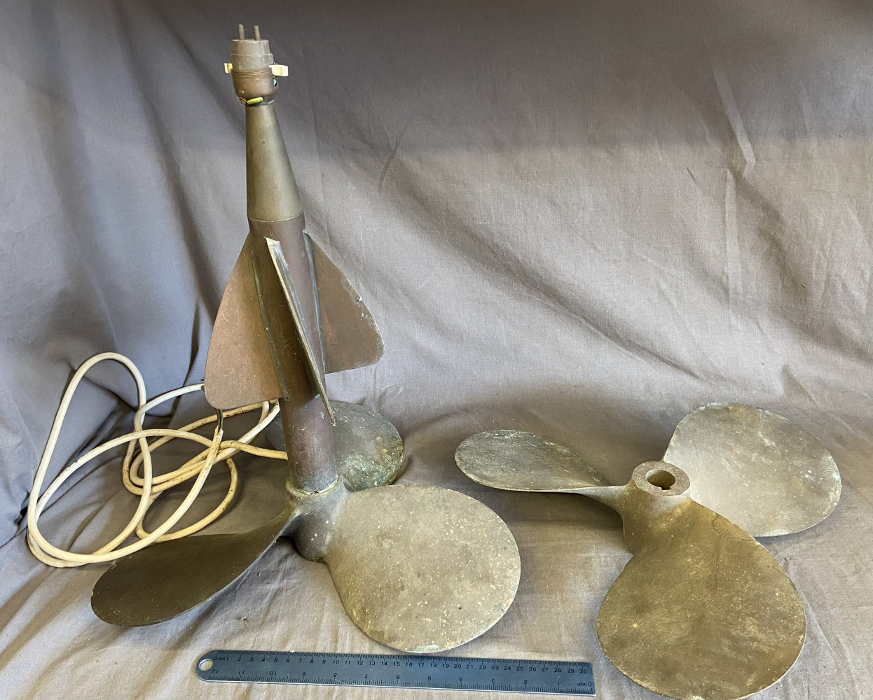 2 brass boat propellers one was once a lamp 45cms high