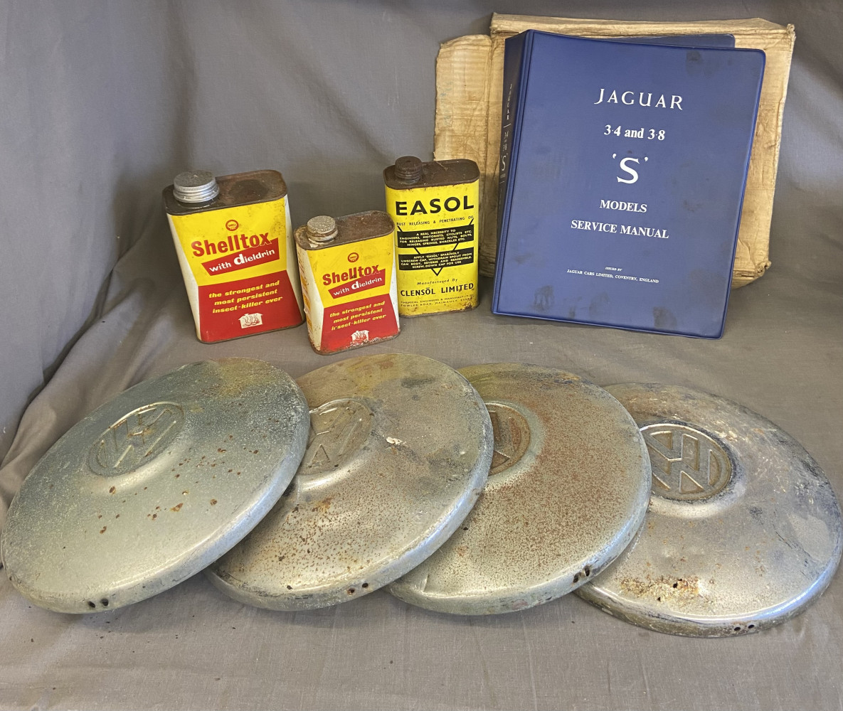 4 VW metal hubcaps, collectables tins and Jaguar S manual