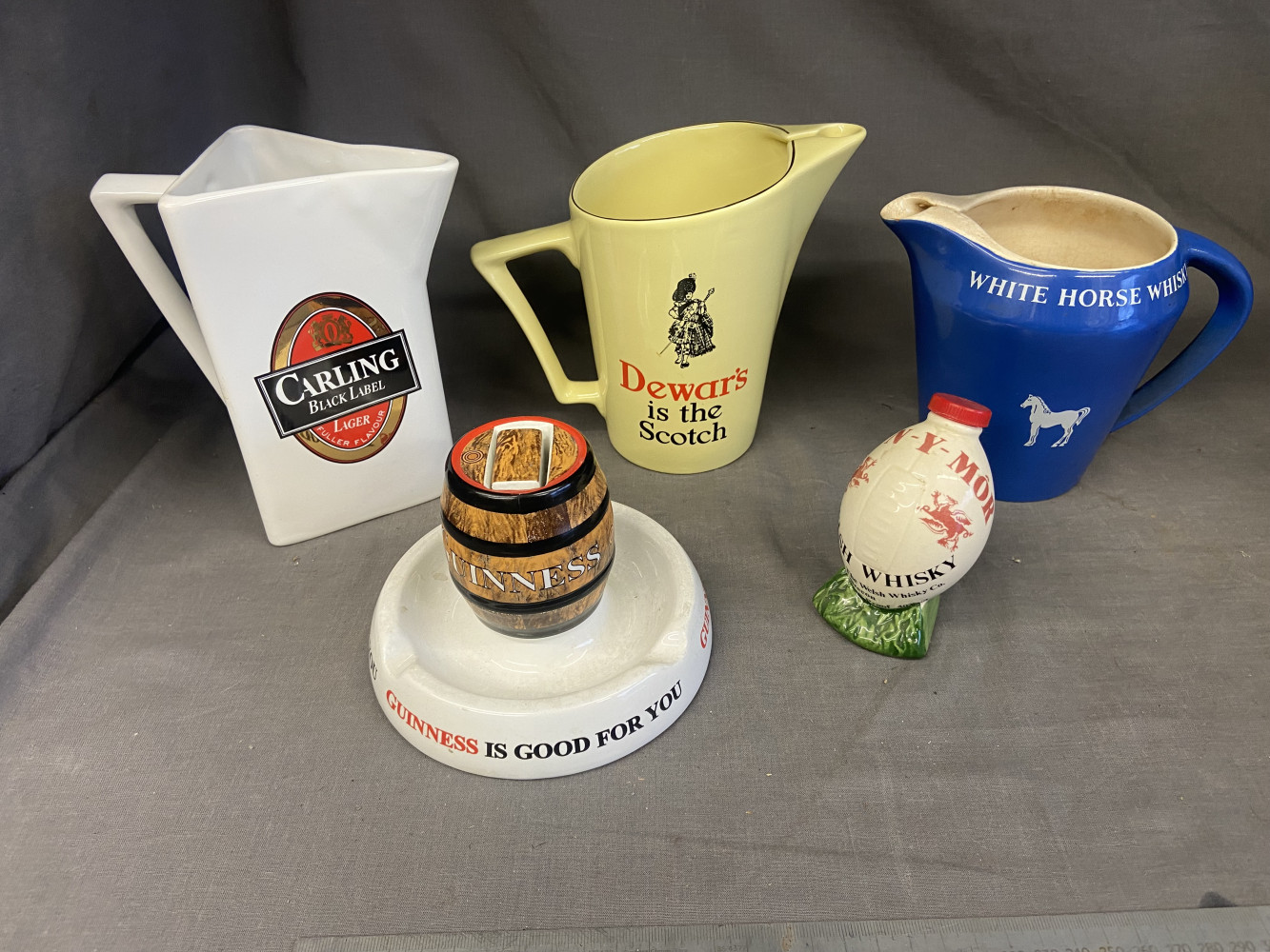 3 Wade Whiskey water jugs and a rare Guinness ash tray