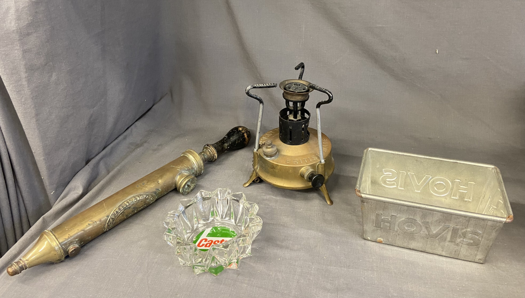 Hovis bread tin, brass garden sprayer, brass stove and ashtray