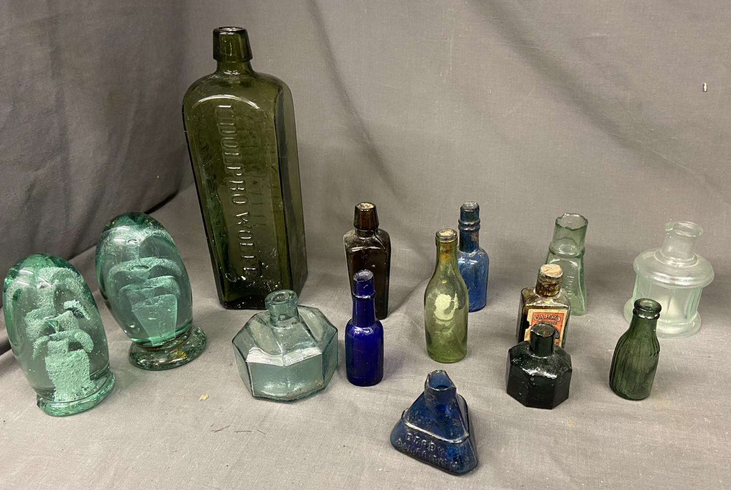 Antique Bottles and two very old paper weights one A/F