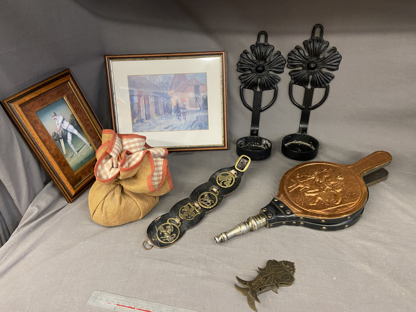2 metal heavy wall candle holders, bellows, horse brasses, door stop and a couple of vintage pictures