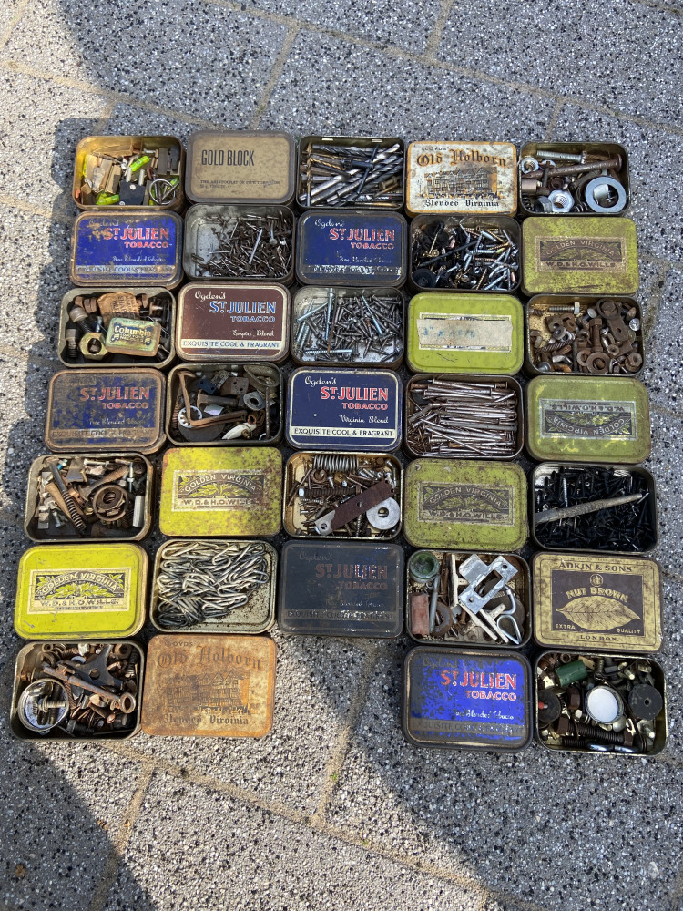 34 tins mostly full of various bits and bobs