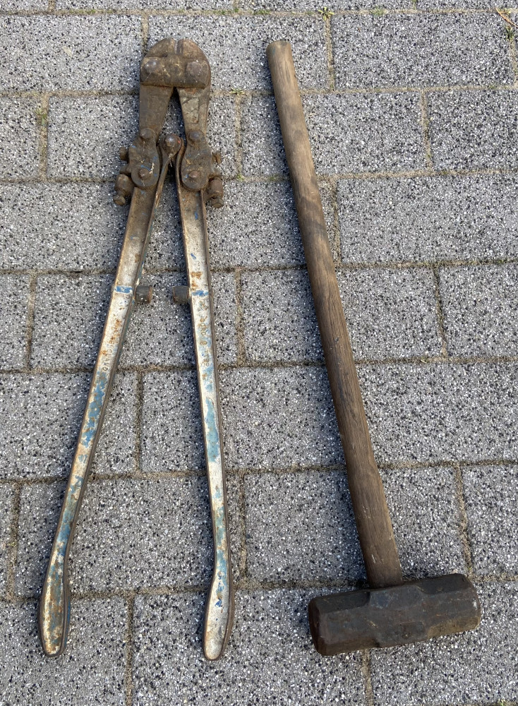 Very large sledge hammer and bolt cutters