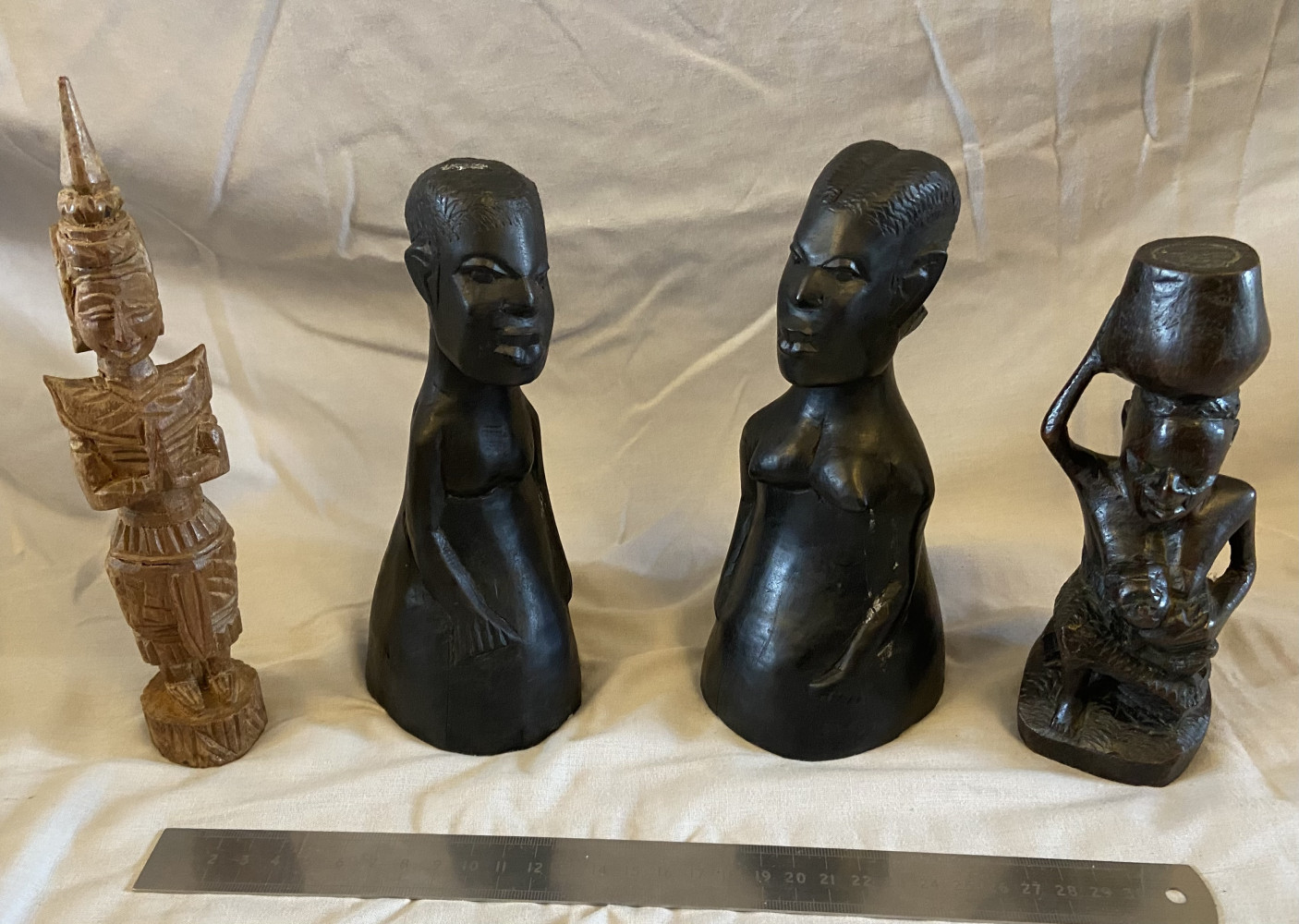 4 wooden statues
