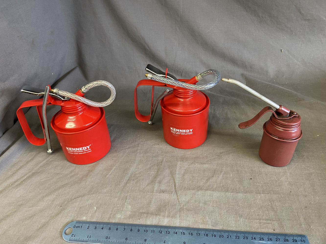 3 oil cans, 2 as new condition