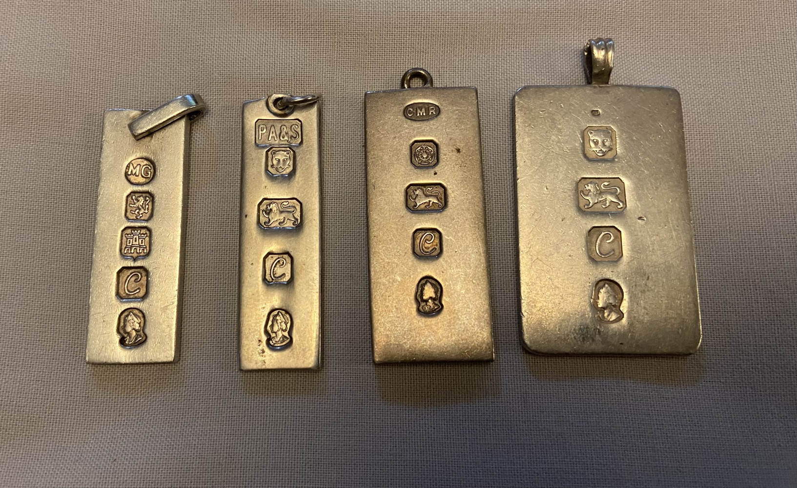 Four silver ingots, 88.9 grams or 3.14 ounces all dated 1977