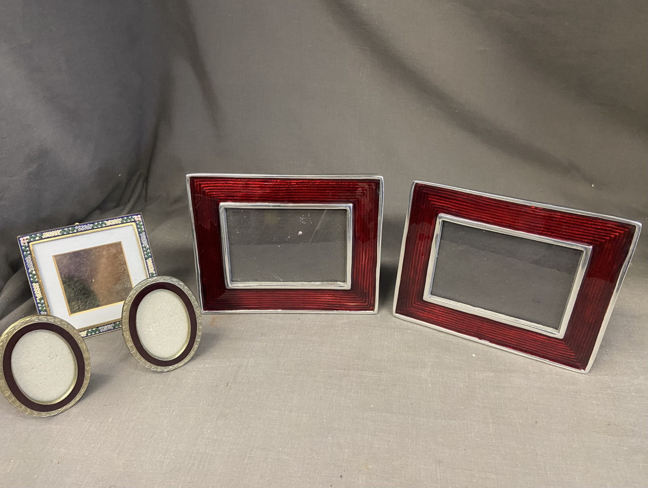 2 lovely enamelled red picture frames, two smaller enamelled frames and one other