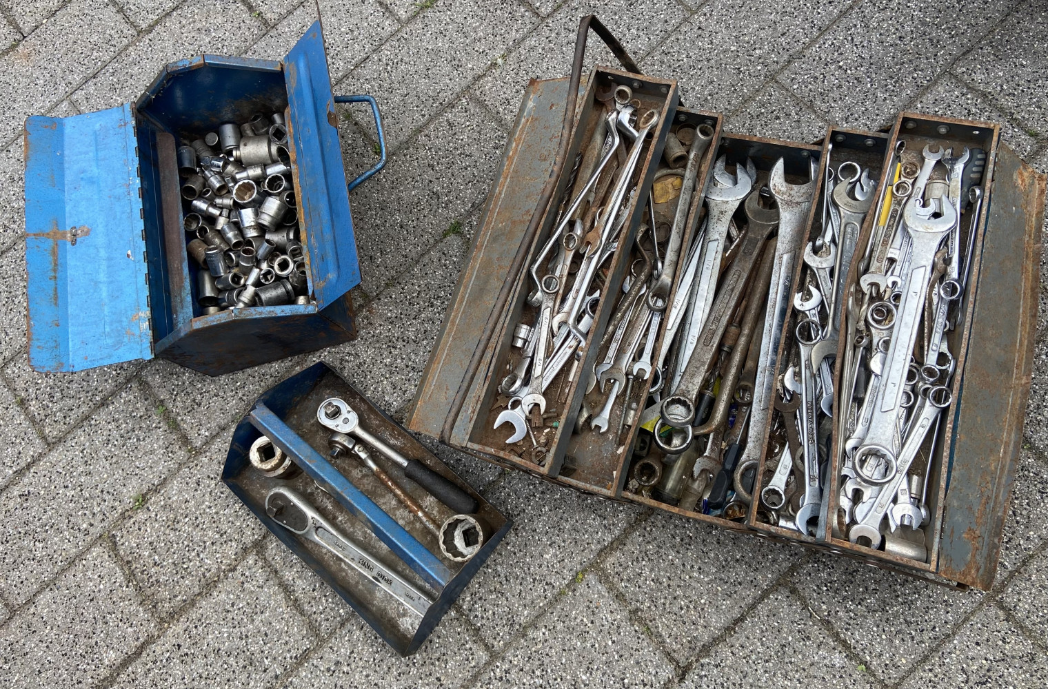 Large tool box loaded with spanners and and another tool box full of mixed sockets and ratchets