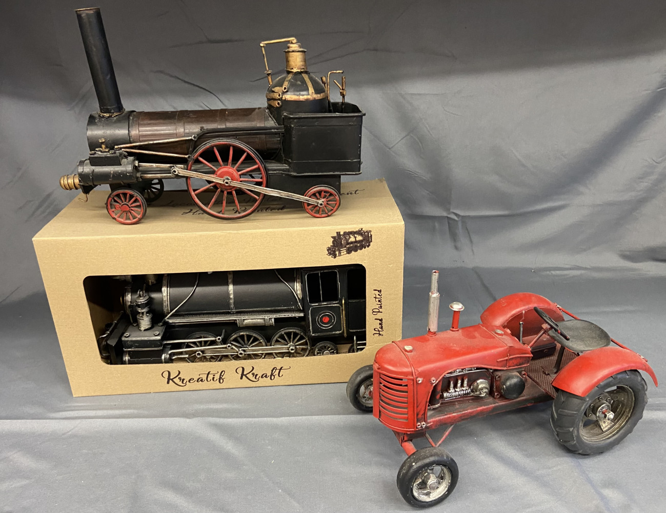 2 Metal Trains one boxed and large metal Tractor