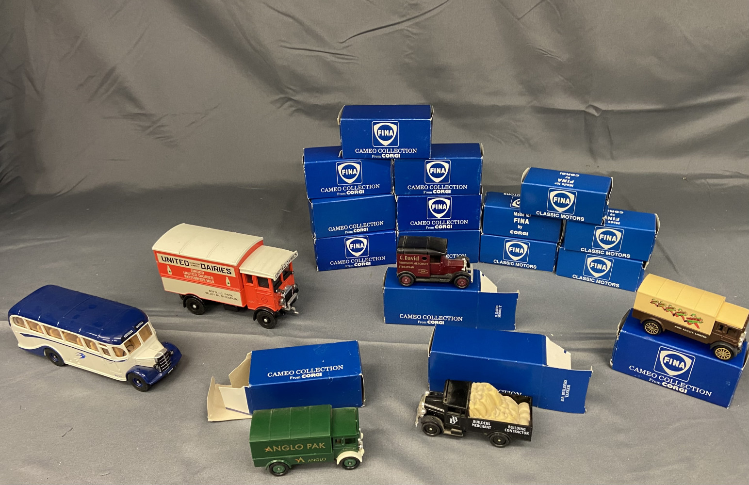 Boxes Corgi vehicles and 2 larger ones unboxed