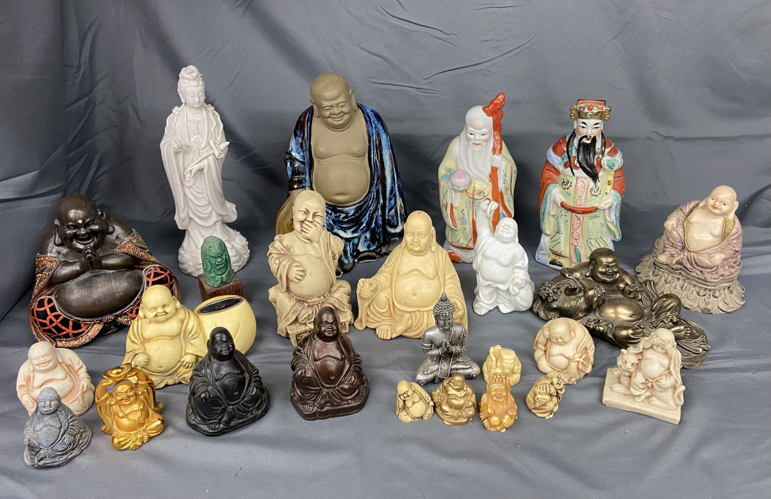 This is a collection of various Laughing Buddha figures and other East Asian figurines large blue Buddha 23cms