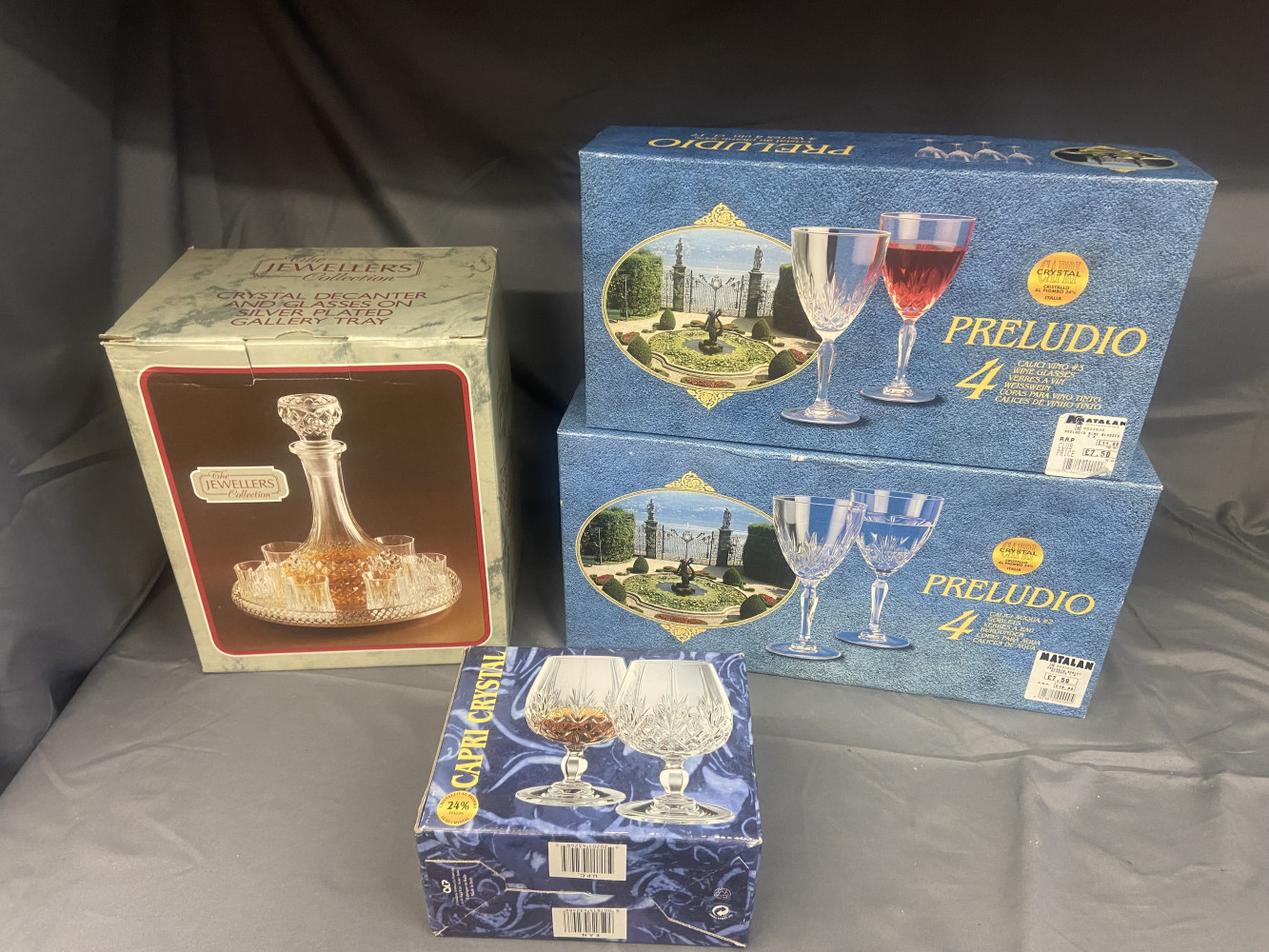 Boxed crystal glasses and decanter set on tray