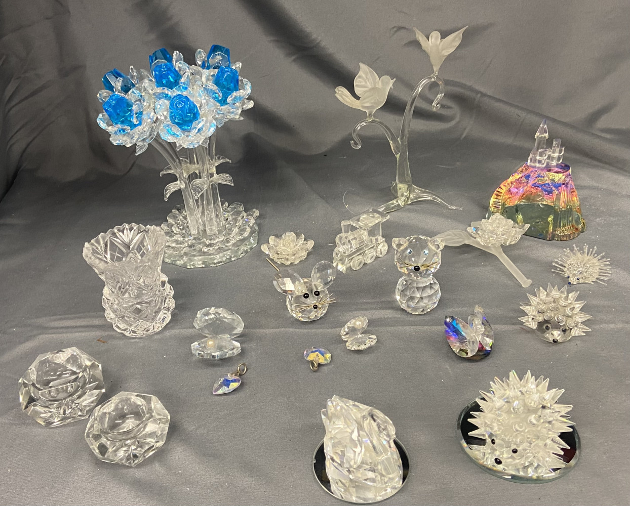 Swarovski swan and hedgehog and large lot of cut glass and crystal figures