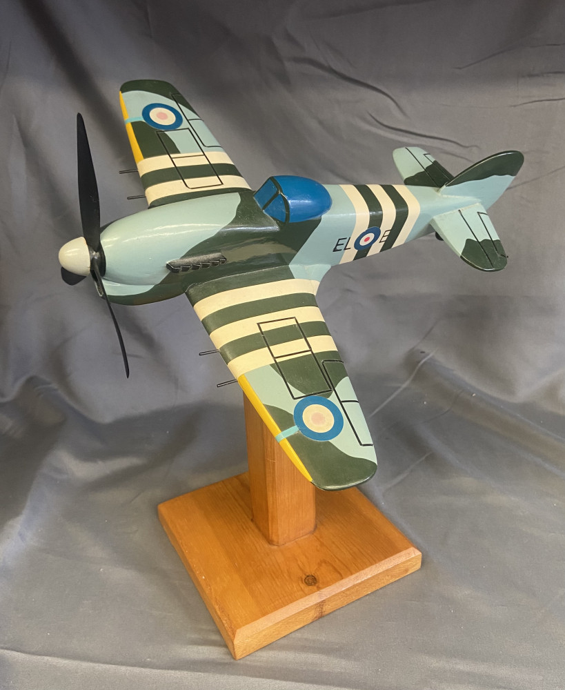 Model plane on wooden stand 32cms high