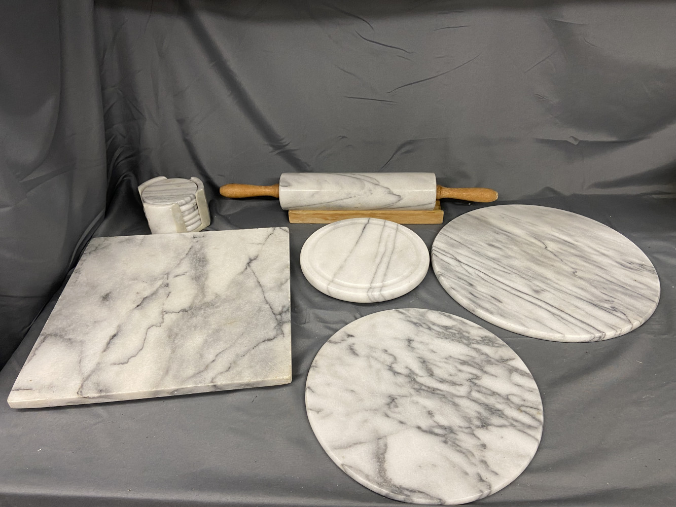 Marble kitchen items including rolling pin and cutting boards