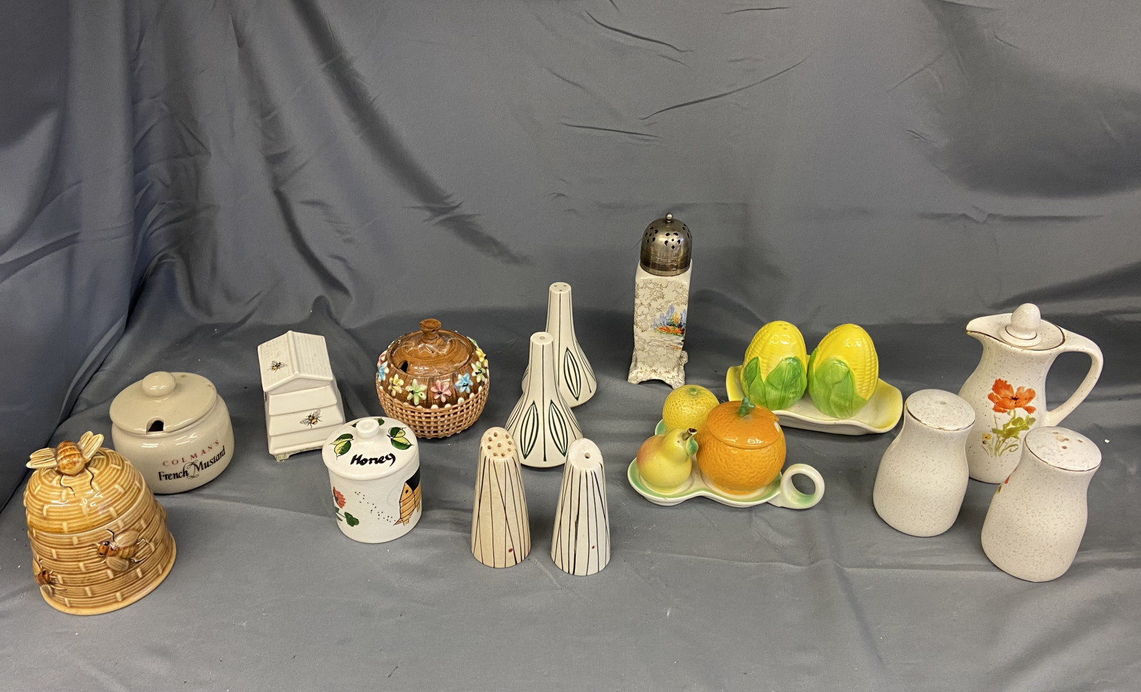 Collection of salt and pepper sets, honey jars and other condiment sets