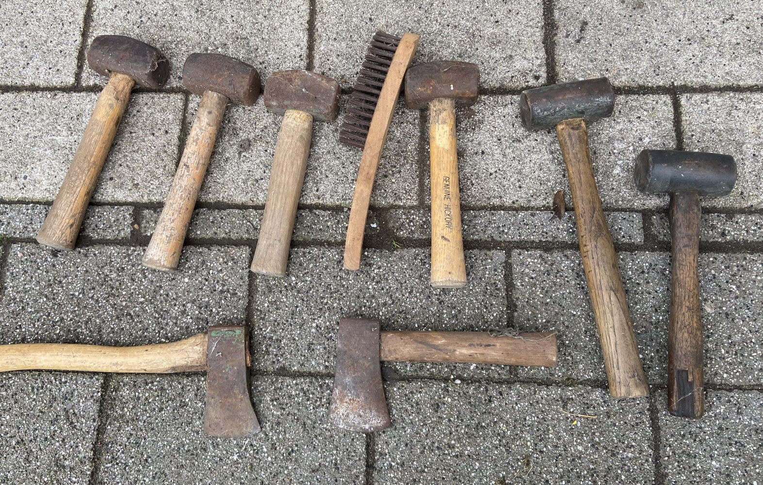 2 copper hammers, 4 club hammers , 2 axes and a brush
