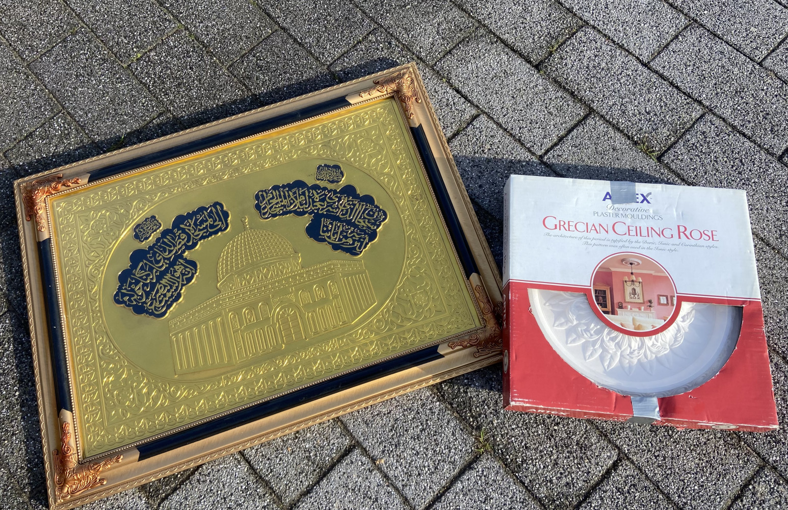 Large gold picture and plaster ceiling rose