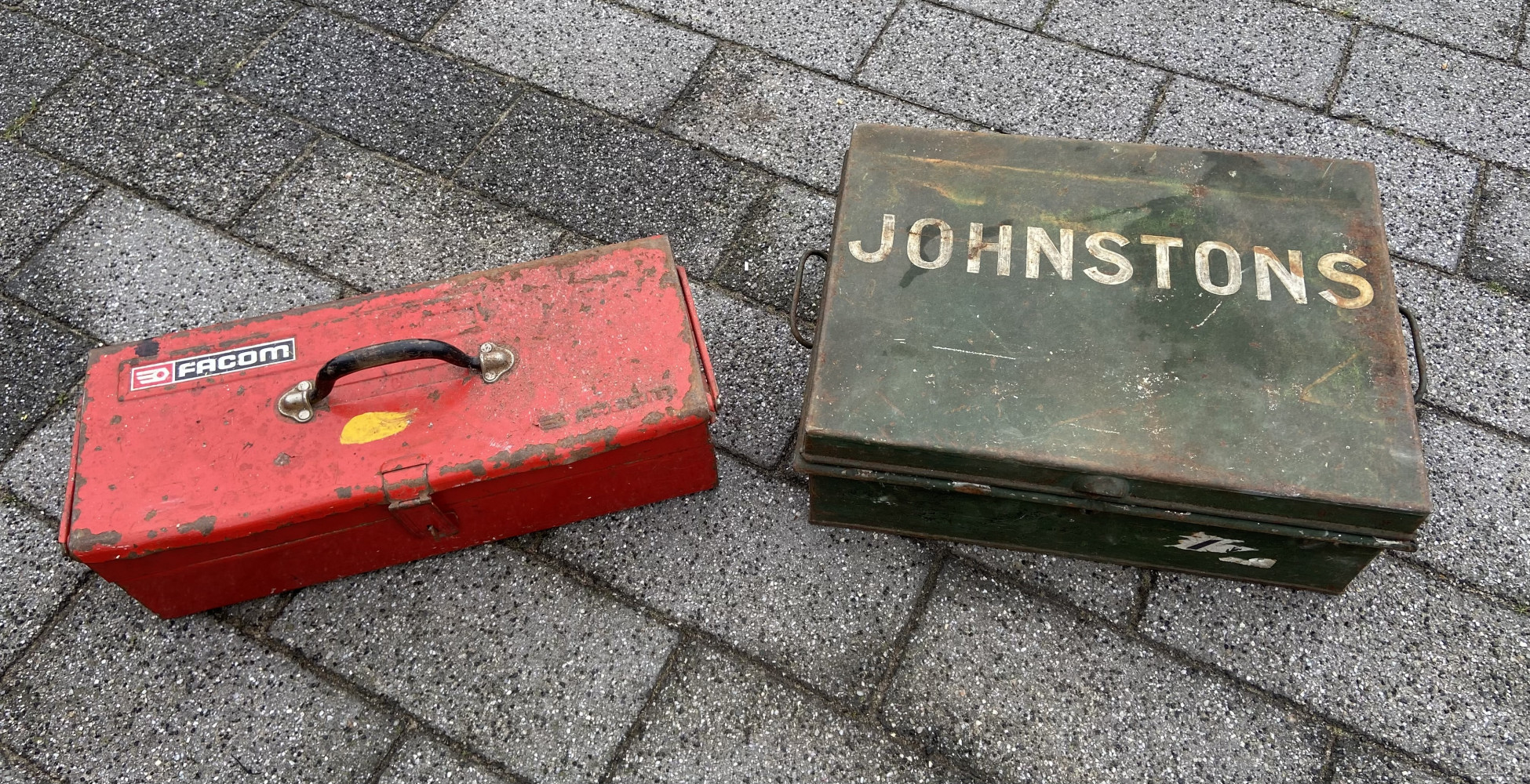2 metal boxes loaded with various hand tools