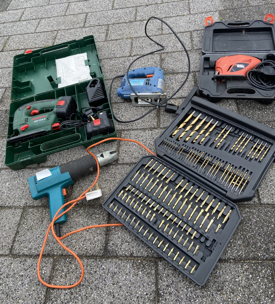 4 power tools and large set of drill bits