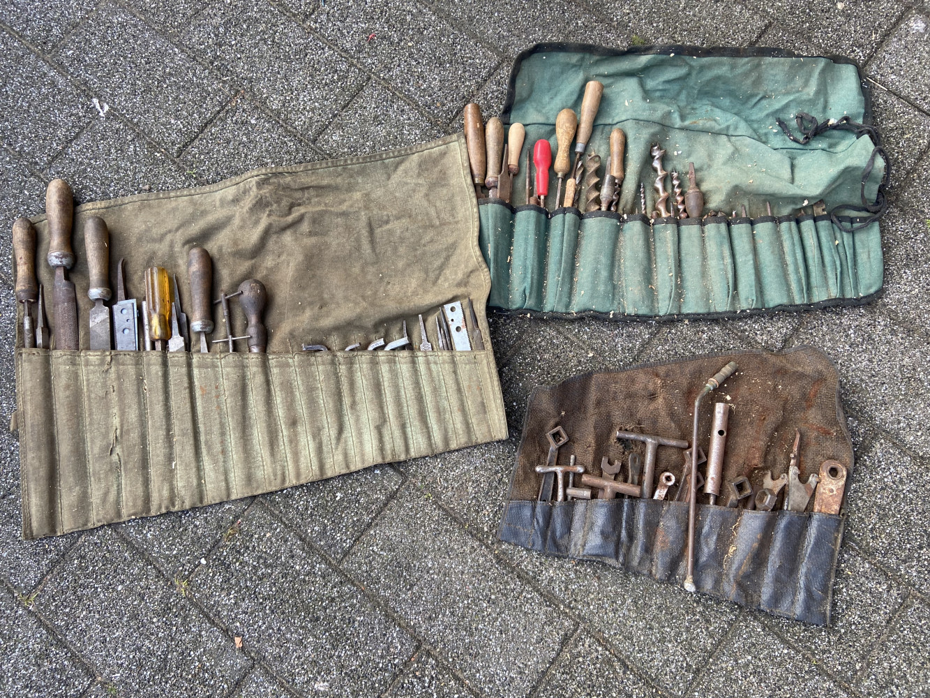 3 tool rolls with various mixed tools