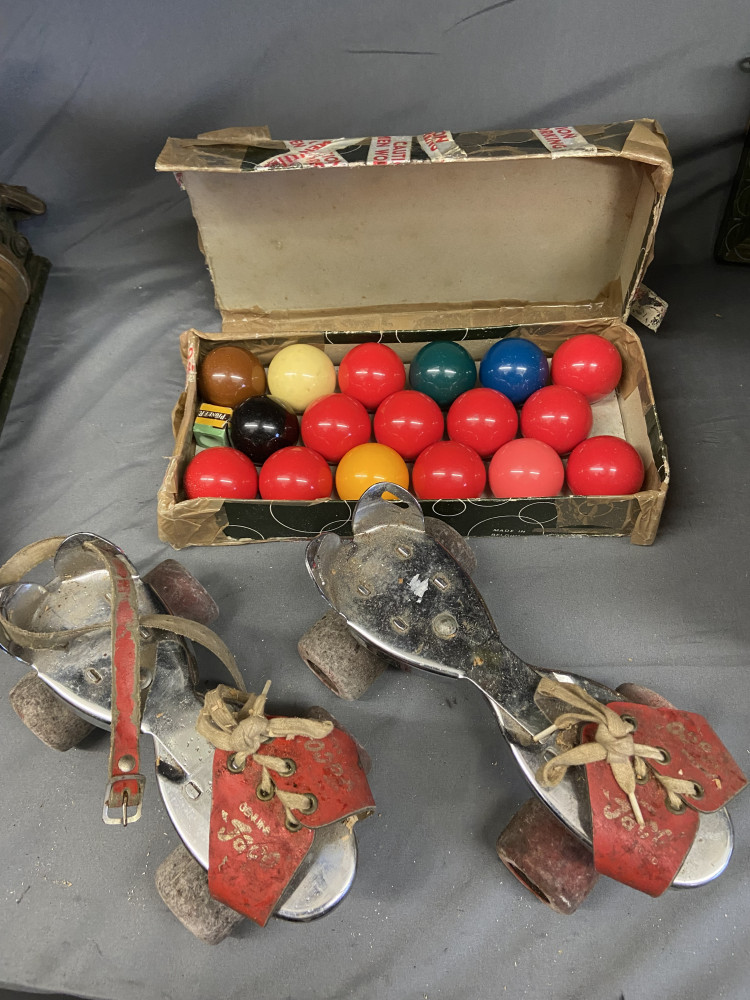 Vintage pair of  roller skates and pool balls