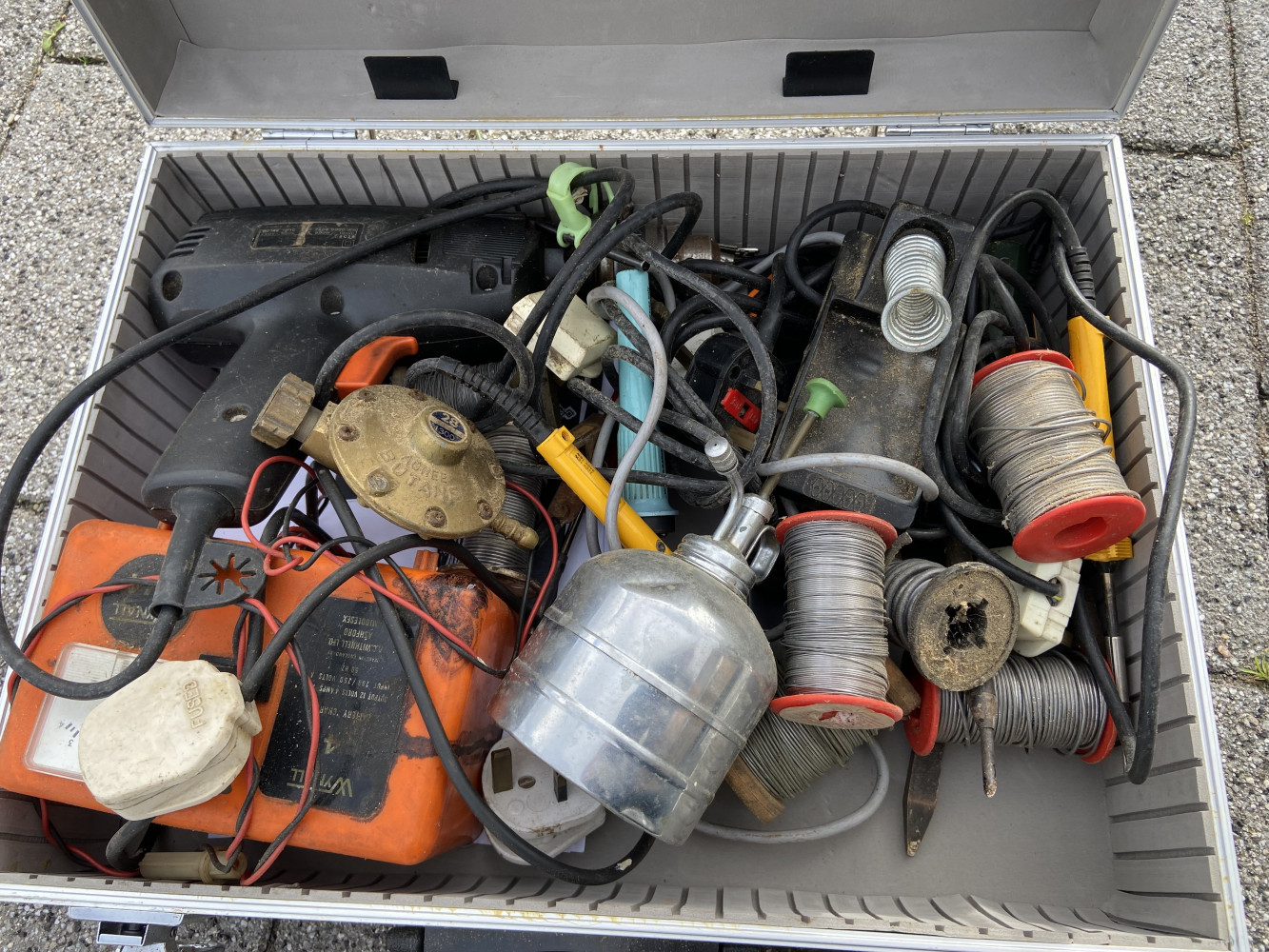 Box full of soldering irons and other electrical items