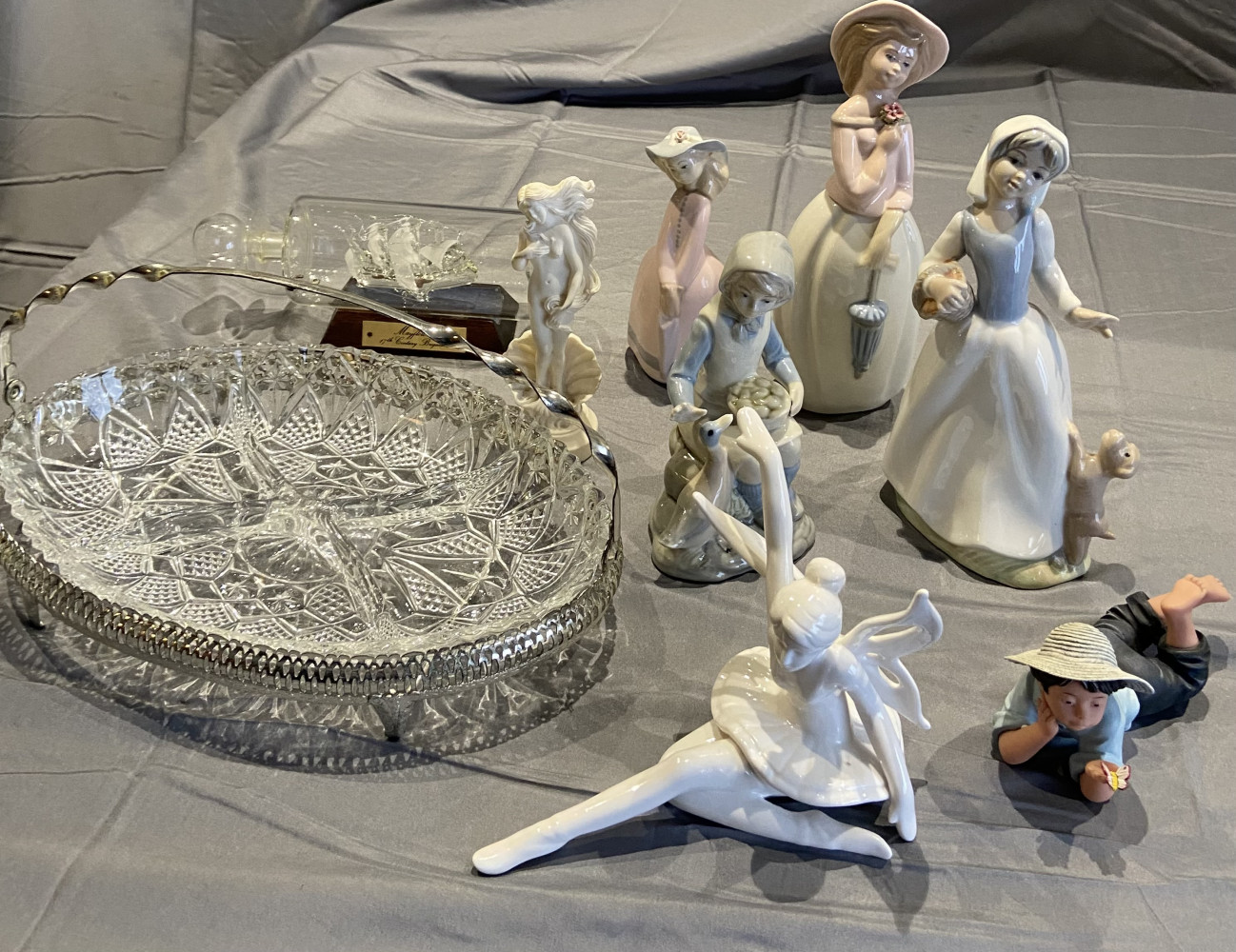 Glass ship in bottle, dish with handle and mixed lot of various collectable figures