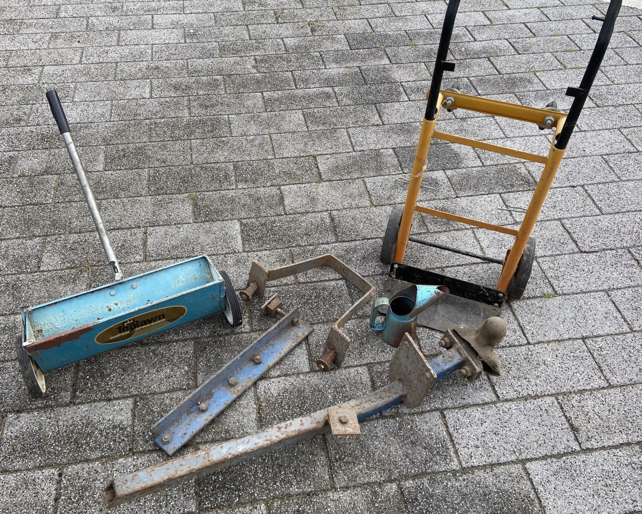 Trolley, lawn seeder, tow bar and small oil can