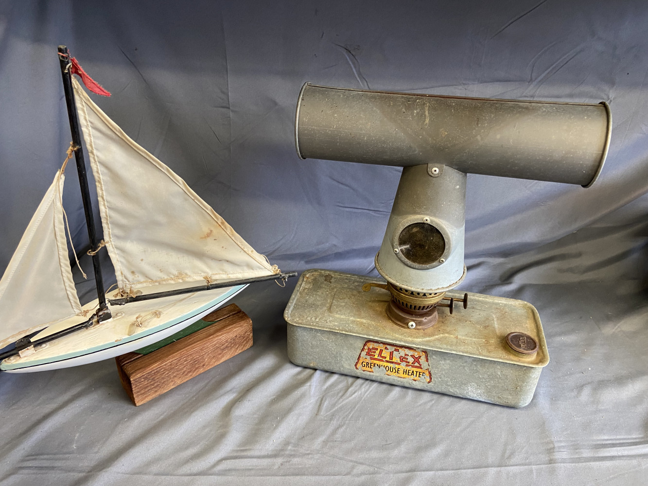 Original Pariffin green house heater and lovely antique model boat